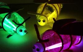 Glowing fire flies made from a pop bottle and glow sticks.