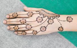 Image of a hand with a henna tattoo. 